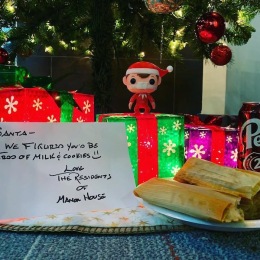 a Christmas tree with presents and food
