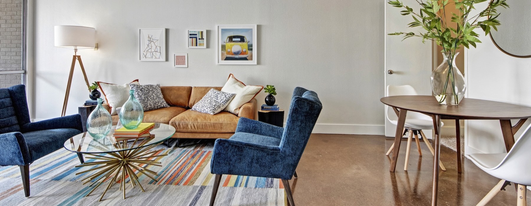 a living room with a couch and chairs