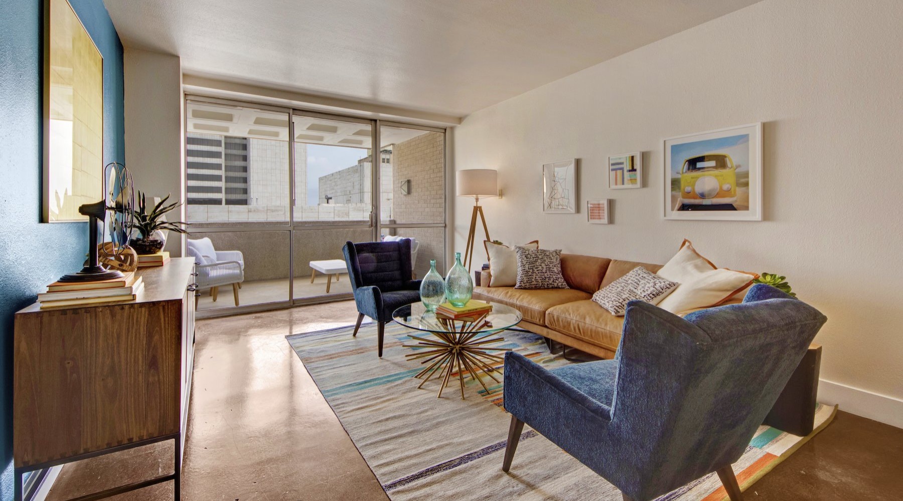 a living room with a couch and chairs
