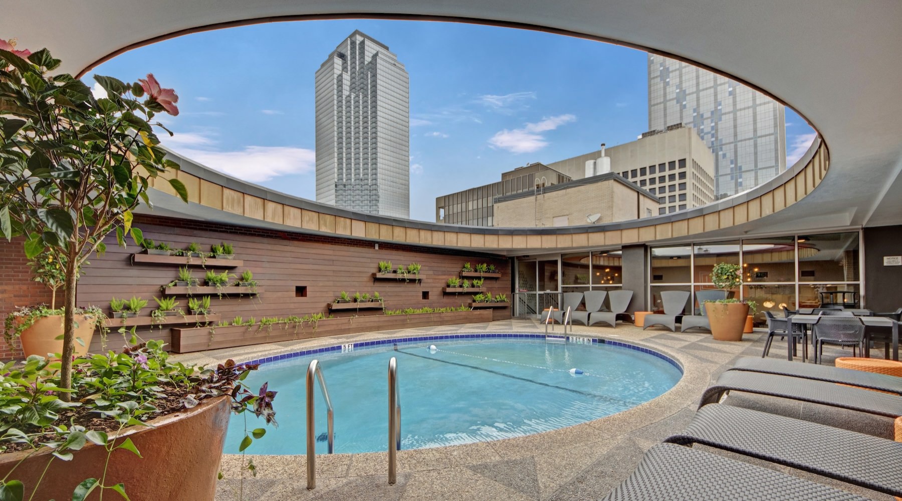 a swimming pool with chairs