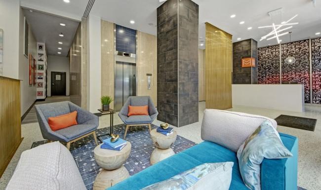 a lounge with a couch and chairs