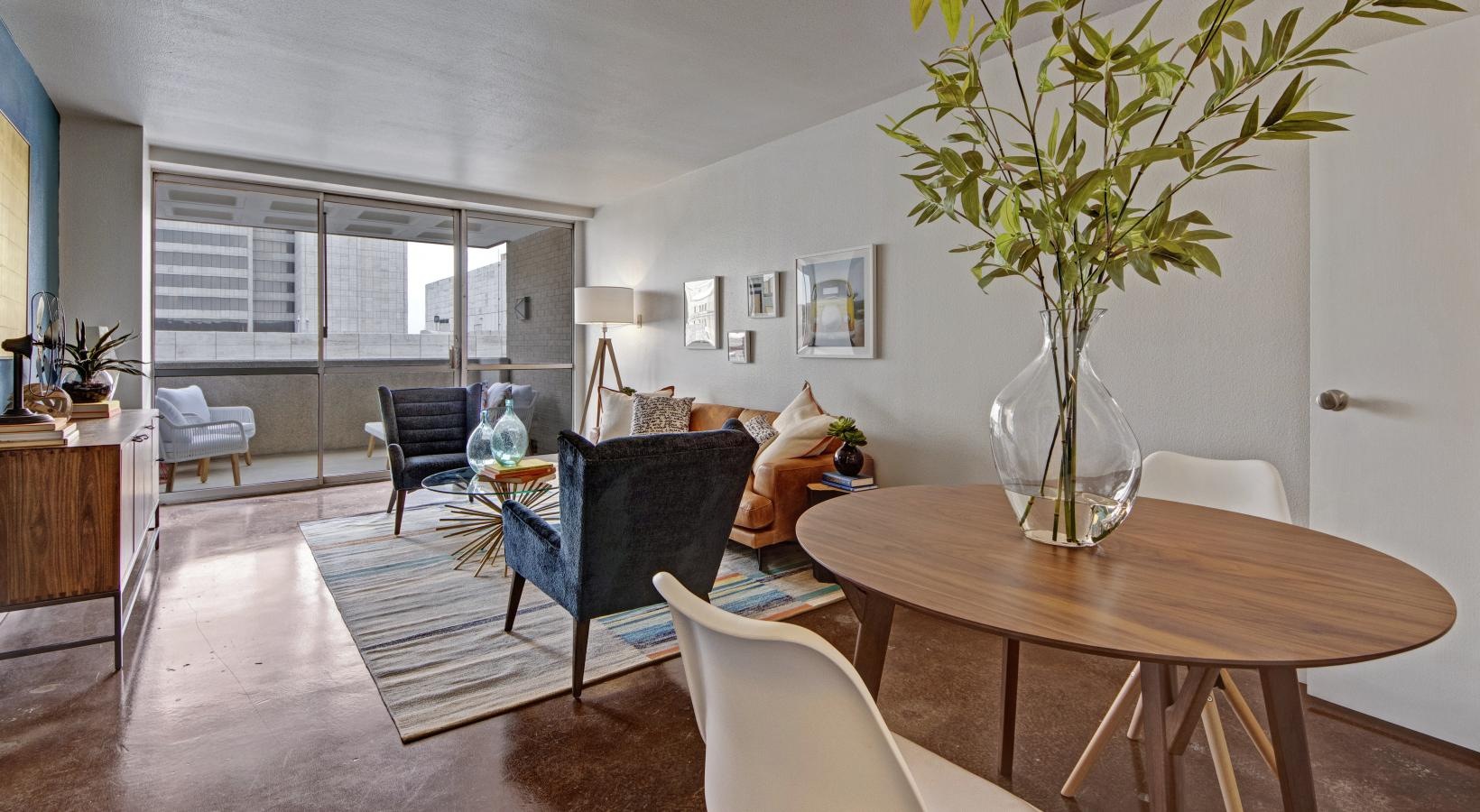 a living room with a table and chairs